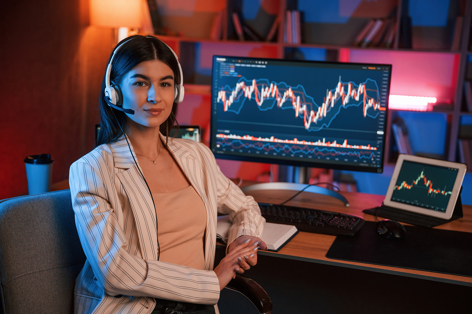 Female stock trader is working by pc indoors. Conception of exchange and money